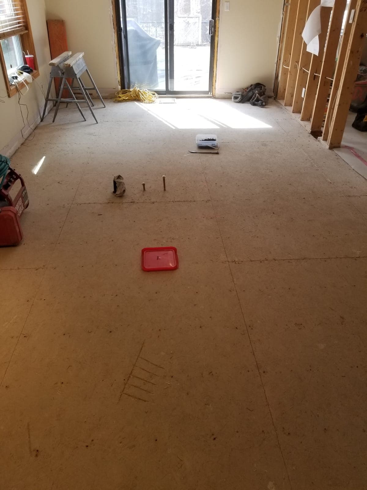 Subfloor glued and screwed for strength and squeak prevention